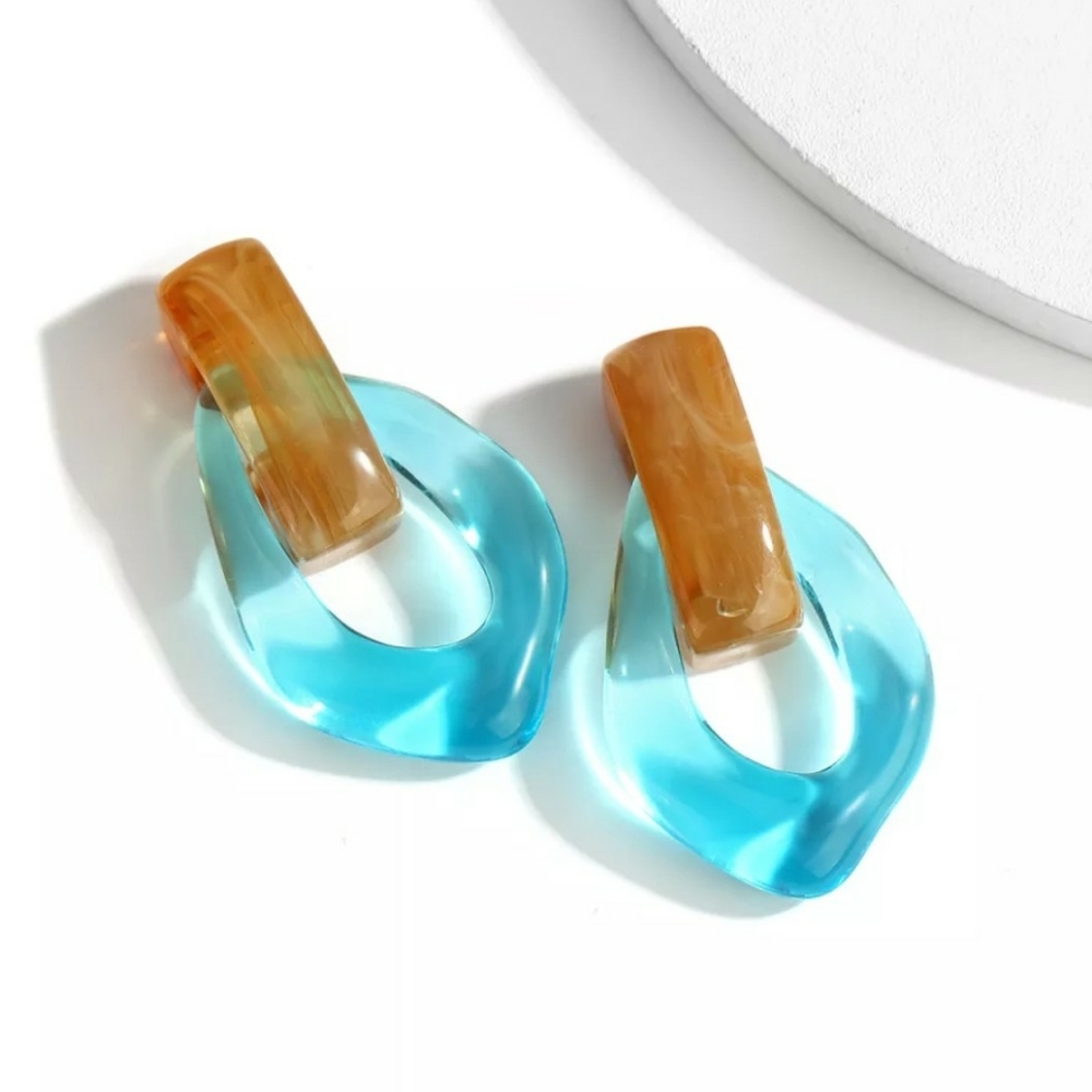 Transparent blue and tan tortoise resin earrings.